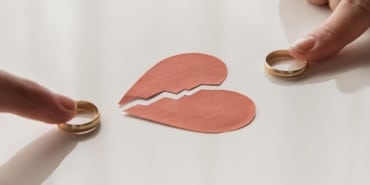 high-angle-hands-touching-wedding-rings