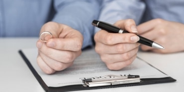 close-up-couple-signing-divorce-contract-3