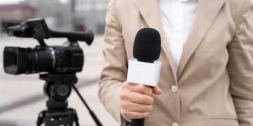 front-view-journalist-holding-microphone