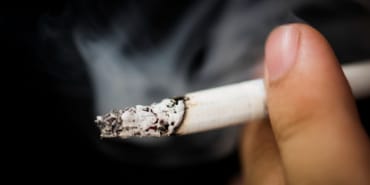 closeup-hand-holding-cigarr