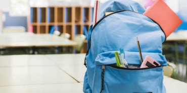 blue-schoolchild-backpack-table