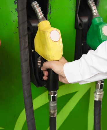 man-putting-gasoline-fuel-into-his-car-pump-gas-station-1