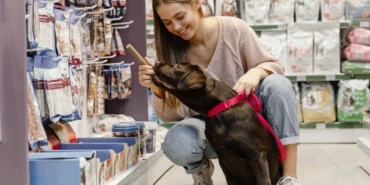 adorable-dog-with-owner-pet-shop