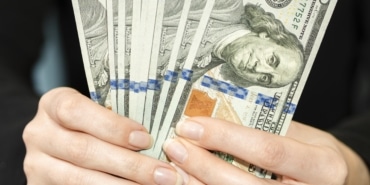 front-view-person-holding-money (1)