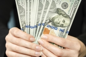 front-view-person-holding-money (1)