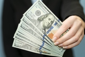 front-view-person-holding-money