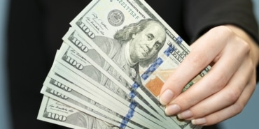 front-view-person-holding-money