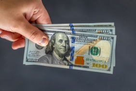 hand-holding-money-international-currency-exchange-world-money