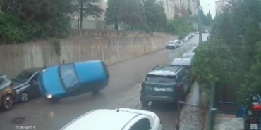 BURSA'DA KONTROLDEN ÇIKAN OTOMOBİL PARK HALİNDEKİ ARACA ÇARPARAK TERS DÖNDÜ: 3 YARALI